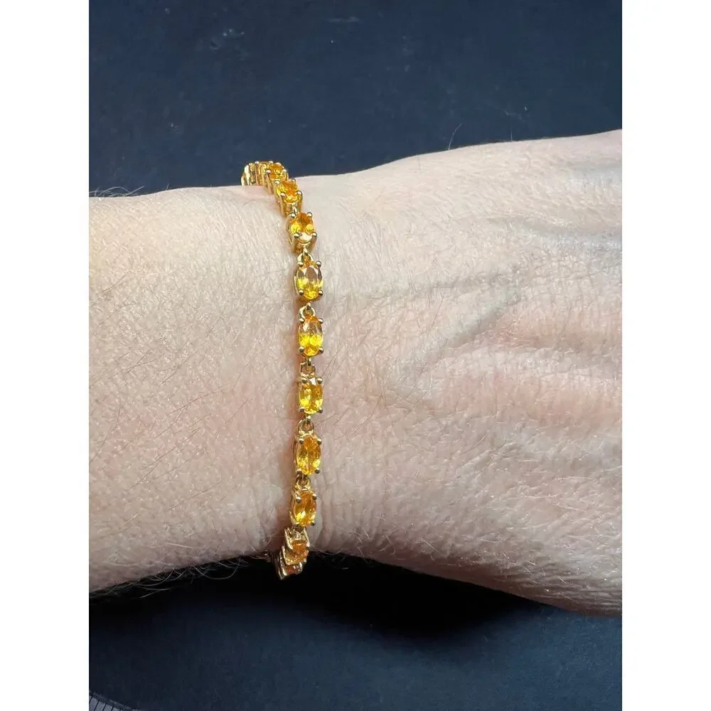Yellow spessartine garnet tennis bracelet in gold over sterling silver